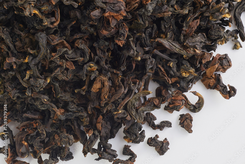 dried leaves of premium Taiwanese tea, macro photo on a white background dried leaves of premium Taiwanese tea, macro photo on a white background
