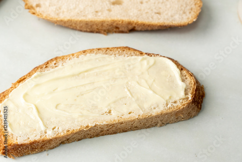 Sliced sourdough bread with butter 