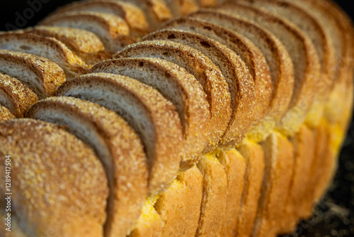 Sliced white bread with cornmeal top 