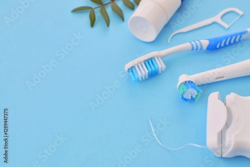 Toothbrushes, dental floss and toothpaste. Daily oral and dental care. Copy Space.