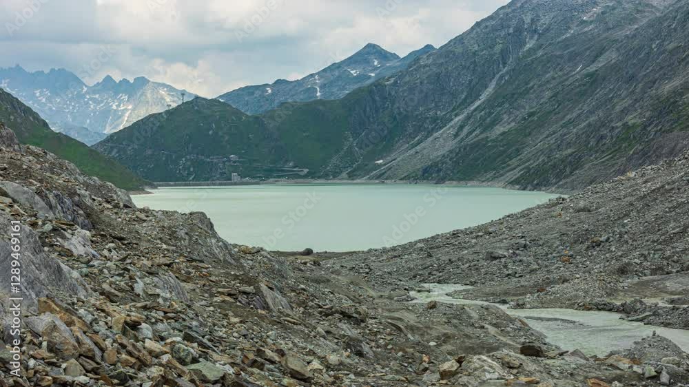 custom made wallpaper toronto digitalTime lapse, artificial lake in the Swiss Alps. Oberaarsee. Lake near the Grimsel Pas. Hydroelectric reservoir. Canton Berne, Switzerland.