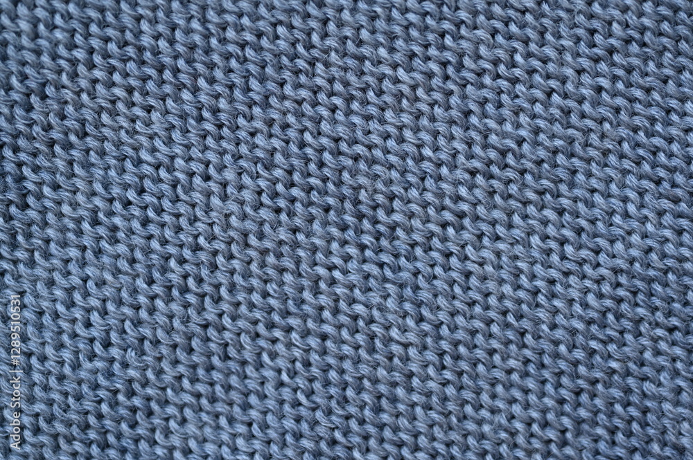 gray texture of knitted wool fabric as a background, smooth symmetrical lines of hand-knitted needlework pattern
gray texture of knitted wool fabric as a background, smooth symmetrical lines of hand-knitted needlework pattern