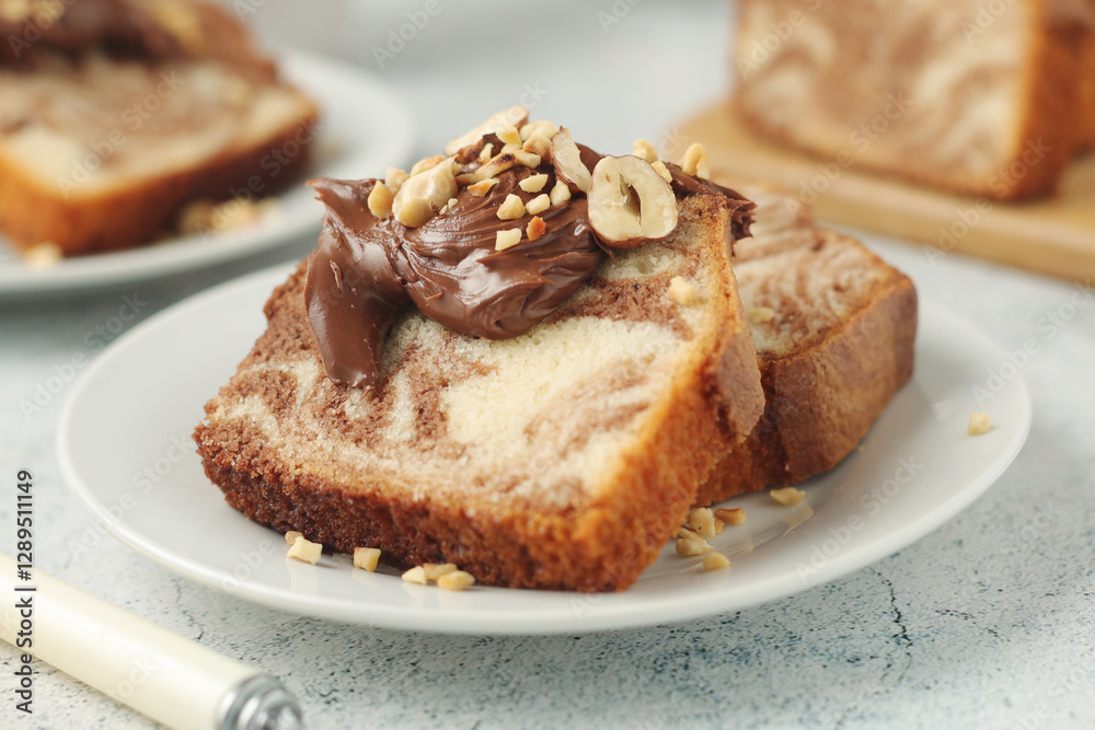A piece of marble biscuit with chocolate cream and nuts A piece of marble biscuit with chocolate cream and nuts