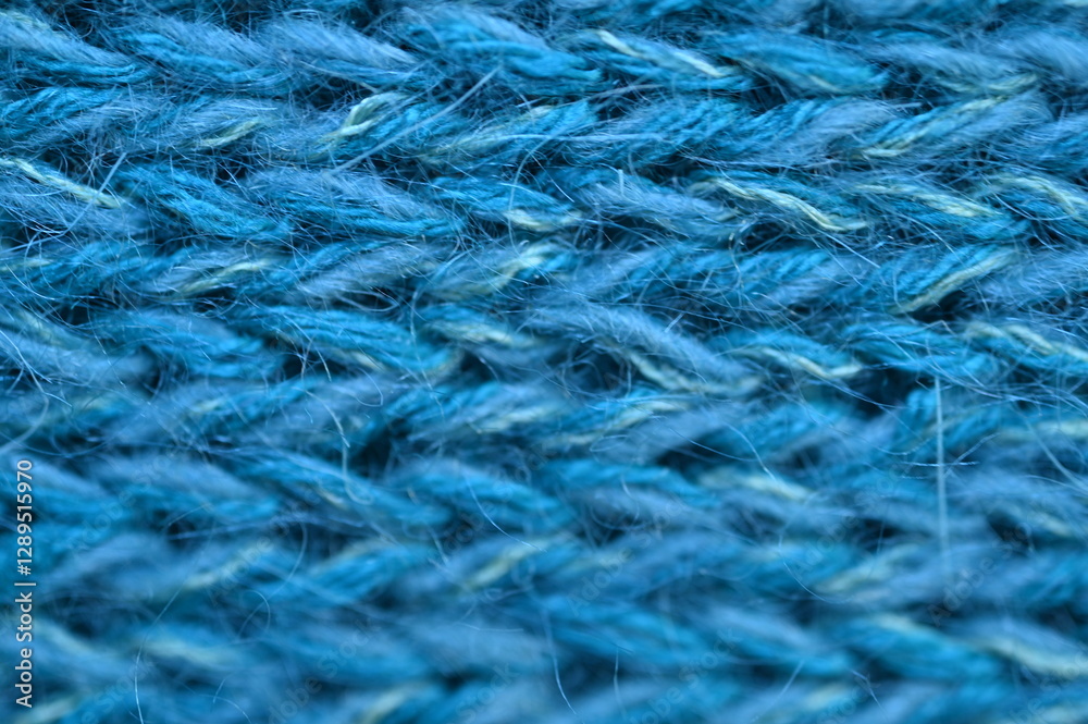 blue texture of knitted wool fabric as a background, smooth symmetrical lines of hand-knitted needlework pattern
blue texture of knitted wool fabric as a background, smooth symmetrical lines of hand-knitted needlework pattern