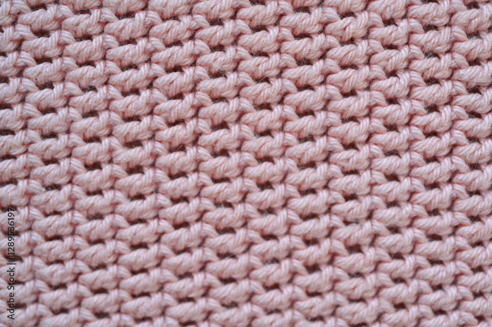 pink crocheted fabric as a background, handmade, close-up of a fragment of a blanket
pink crocheted fabric as a background, handmade, close-up of a fragment of a blanket
