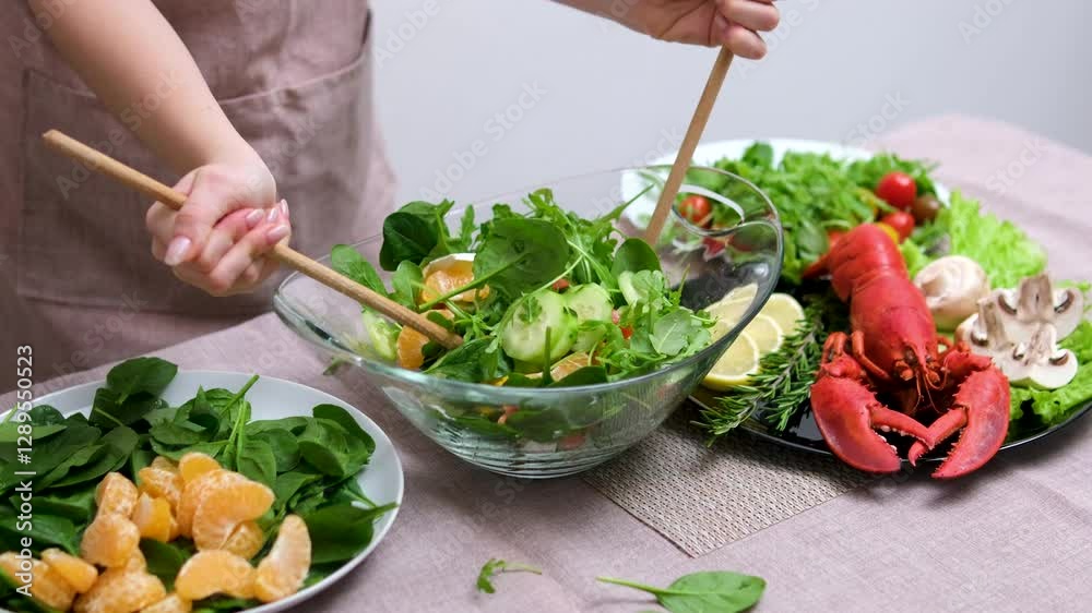 Vegetable fresh salad for healthy eating and dieting. Olive oil is poured into a fresh salad of cabbage radishes cucumbers and onions. Vegetarian healthy food is basis of Mediterranean diet. Close up
