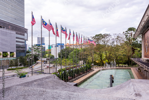 Photography Fountains and Malaysian flags on the street in downtown of Kuala Lumpur, Malaysi