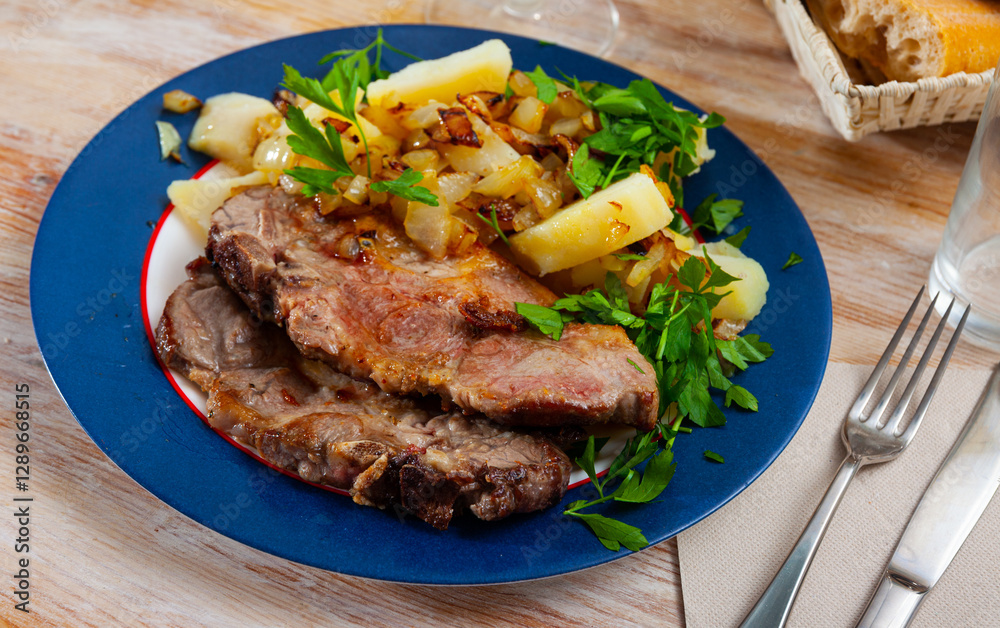 Appetizing grilled pork loin chops with boiled potato Appetizing grilled pork loin chops with boiled potato