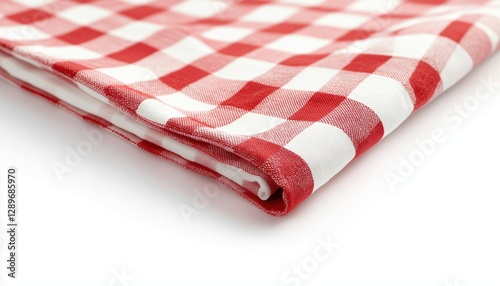 Red And White Checkered Picnic Tablecloth Is Placed On A White Surface Ready For A Picnic. The Classic Design Is Perfect For Outdoor Dining. photo