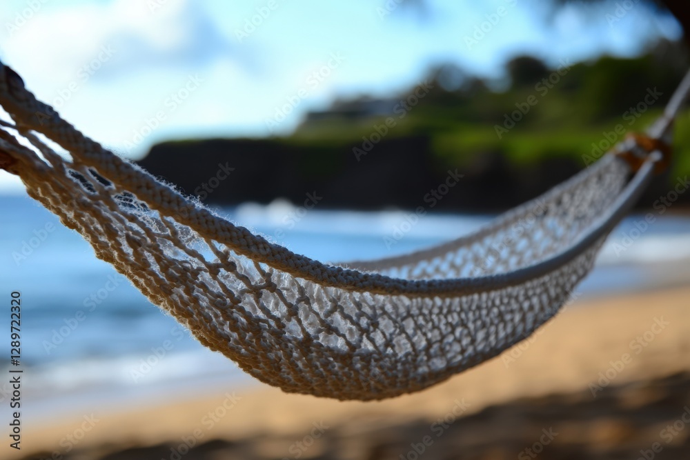 Obraz premium Serene Beachside Scene: A Relaxing Hammock Strung Between Palm Trees with a Background of Gentle Waves and Lush Greenery, Ideal for Leisure and Reflection
