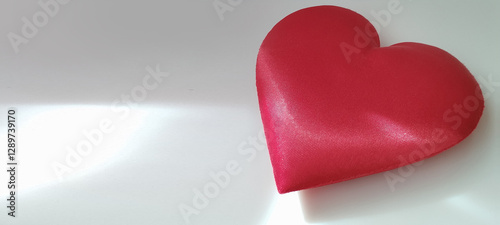 Fotografie Celebrating love with a red heart symbol minimalist setting photography soft lig