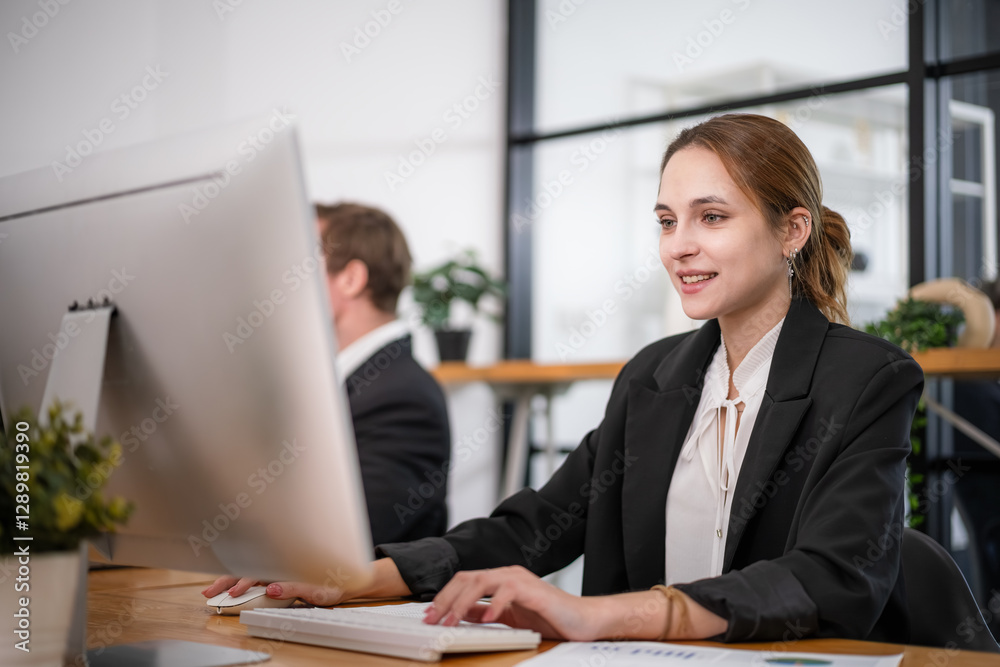 Businesswoman sitting and analyzing business performance in office