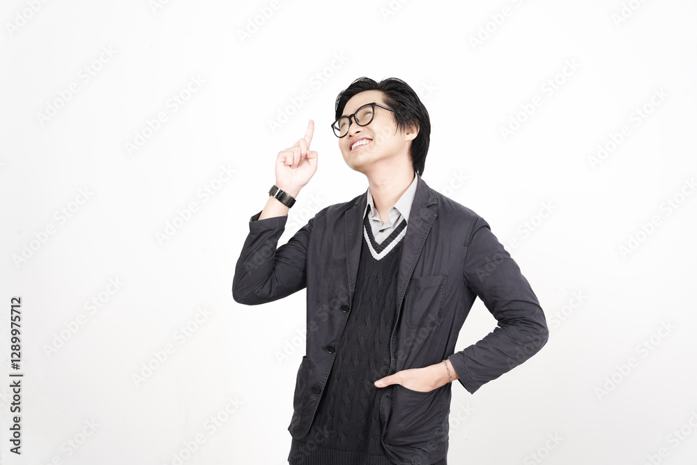 Smiling and pointing up for copy space advertising Of Handsome Asian Man Isolated On White Background Smiling and pointing up for copy space advertising Of Handsome Asian Man Isolated On White Background