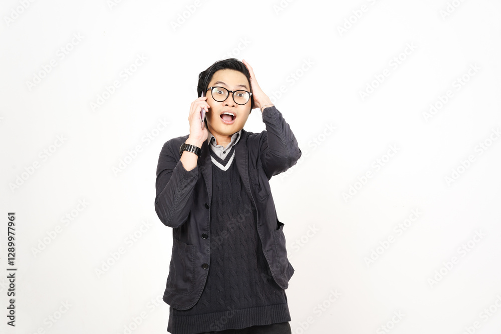 Shocked Surprised face while on phone Of Handsome Asian Man Isolated On White Background Shocked Surprised face while on phone Of Handsome Asian Man Isolated On White Background