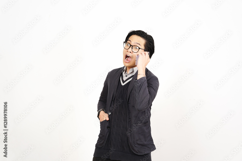 Shocked Surprised face while on phone Of Handsome Asian Man Isolated On White Background Shocked Surprised face while on phone Of Handsome Asian Man Isolated On White Background