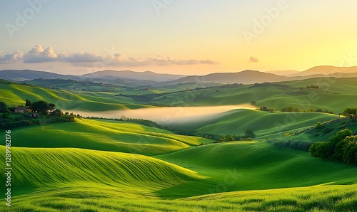 Serene landscape with rolling green hills under a golden sunrise and soft clouds.