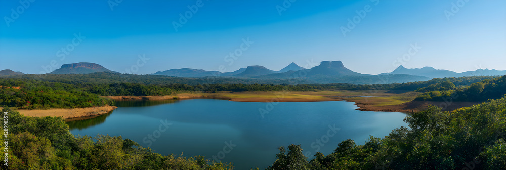 Serenity of a Sprawling Reservoir Encircled by Lush Greenery and Majestic Mountains Amidst a Clear Sky Serenity of a Sprawling Reservoir Encircled by Lush Greenery and Majestic Mountains Amidst a Clear Sky