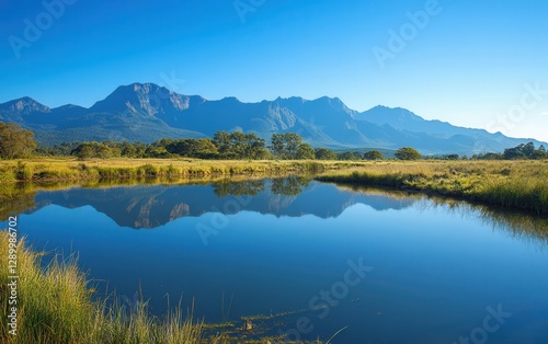 Serene Mountain Reflection Majestic Peaks Reflected in Calm Lake Water, Clear Blue Sky
