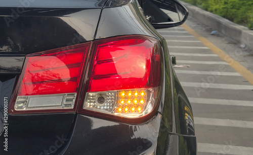 Fotografija Close-up of illuminated car taillight on the way