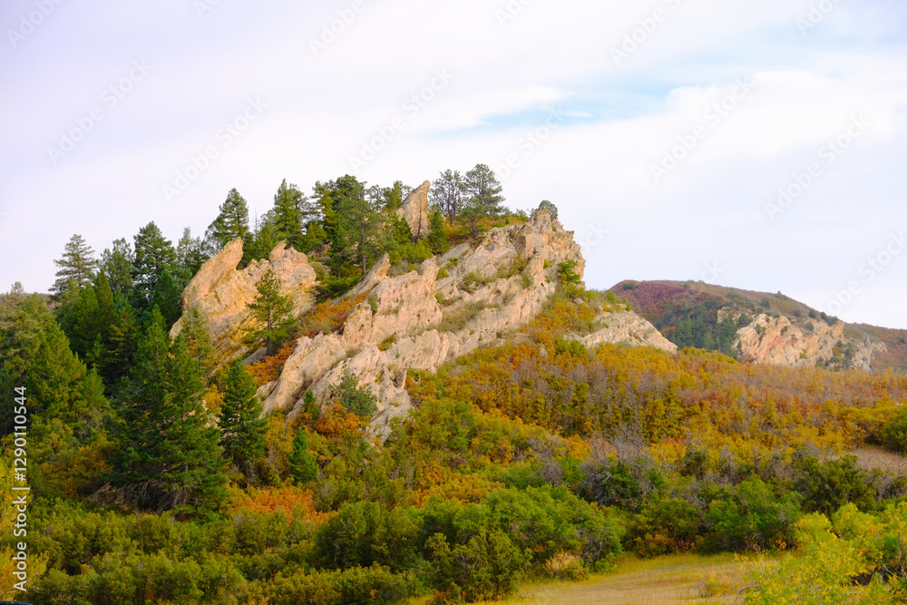 Mountain landscape with rocky formations and trees. Mountain landscape with rocky formations and trees.