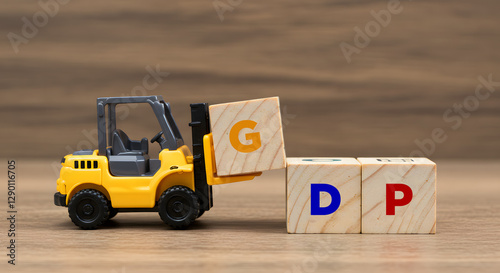 GDP Economic Growth Concept (Gross domestic product or Good distribution practice) Mini Forklift Moving Wooden Letter Blocks