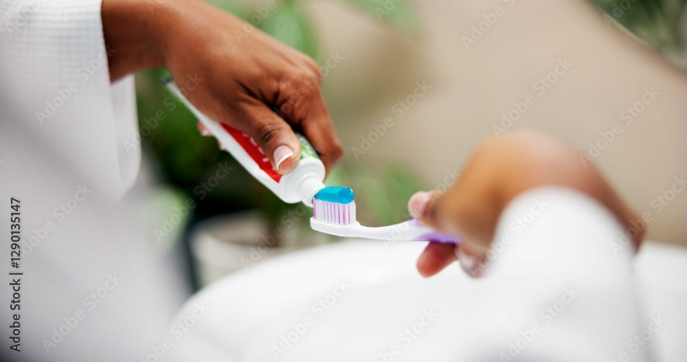Oral hygiene, hands and toothpaste on toothbrush in home for brushing teeth, fresh breath and plaque removal. Morning routine, person and getting ready in bathroom with dental care and mouth cleaning