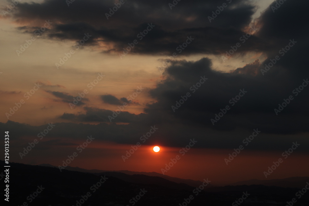 Sunrise over mountains with cloud cover Sunrise over mountains with cloud cover