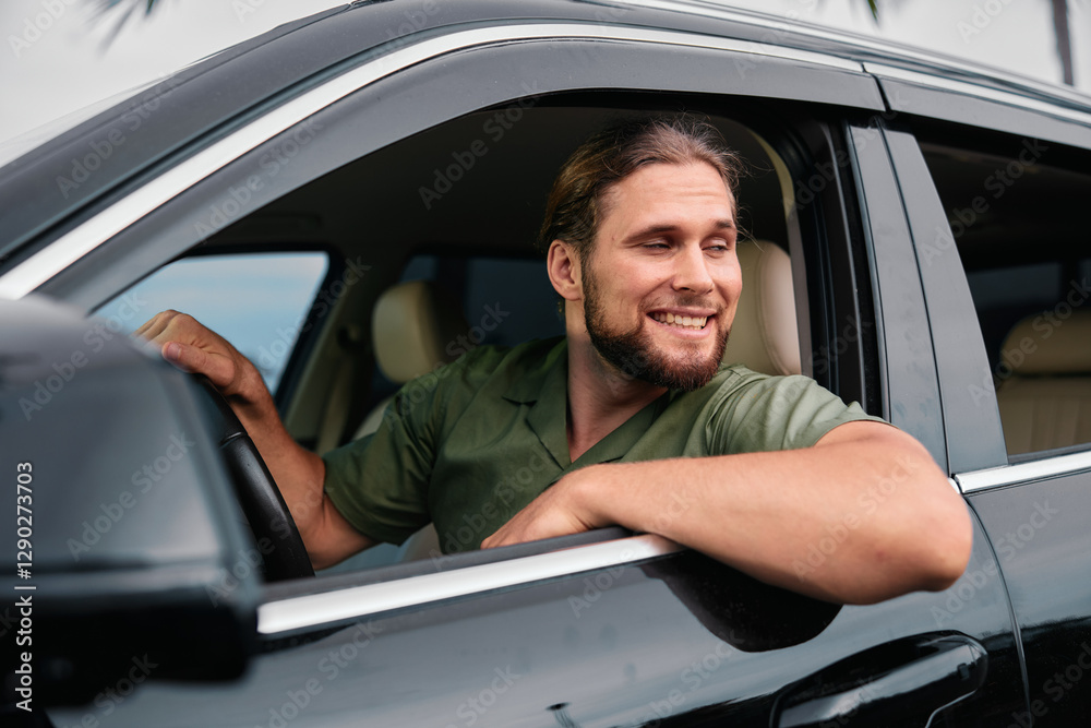 Man smiling from a car window with a scenic background Man smiling from a car window with a scenic background