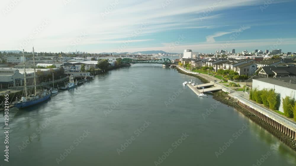 The Tidal Canal reflects the soft hues of the sky as the Park Street Bridge stands as a vital connection over the water. The Tidal Canal reflects the soft hues of the sky as the Park Street Bridge stands as a vital connection over the water.