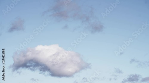 Floating Cumulus Clouds Under a Vibrant Blue Sky