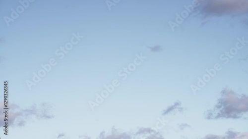 Floating Cumulus Clouds Under a Vibrant Blue Sky