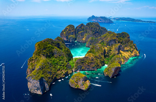 Fototapeta Naklejka Na Ścianę i Meble -  Concept touristic landmark of Thailand, travel photo by drone. Amazing aerial view of Ko Phi Phi Leh with Maya Bay in Andaman sea Krabi