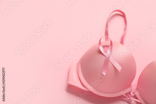 Bra with pink ribbon on col...