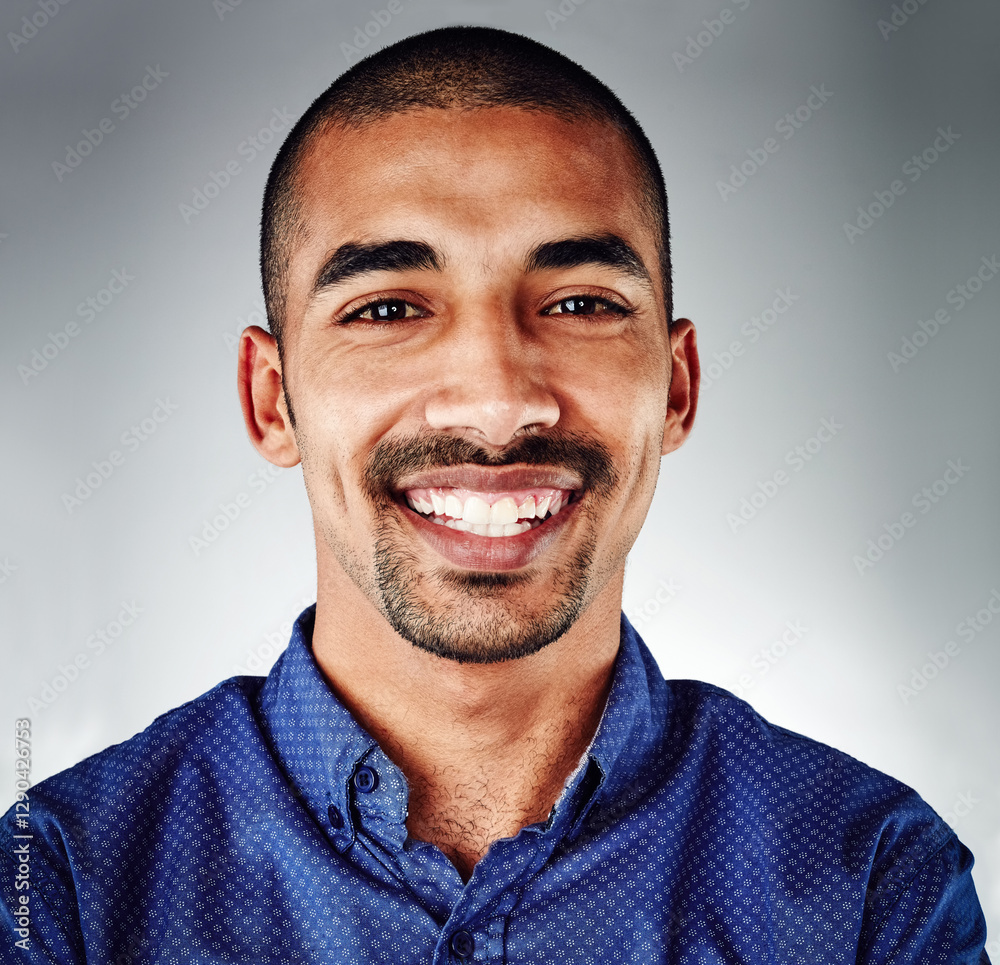 Obraz premium Studio, happy and portrait of man, business and excited for job promotion, creative and journalist. Grey background, smile and internship for reporter in newsroom, press and confident in media agency