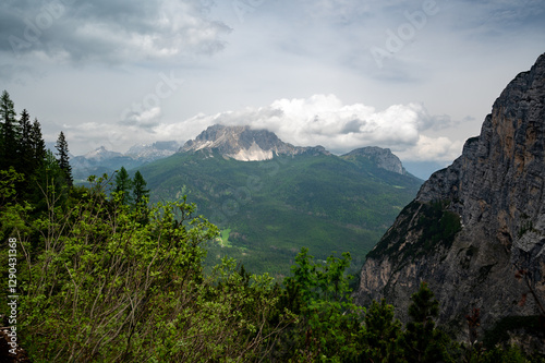 Obraz na płótnie Breathtaking view of forests, mountains, and valleys in the Italian Dolomites (Dolomiti, Dolomiten). Captured from a scenic trail along a rocky ledge. Stunning alpine nature w salonie