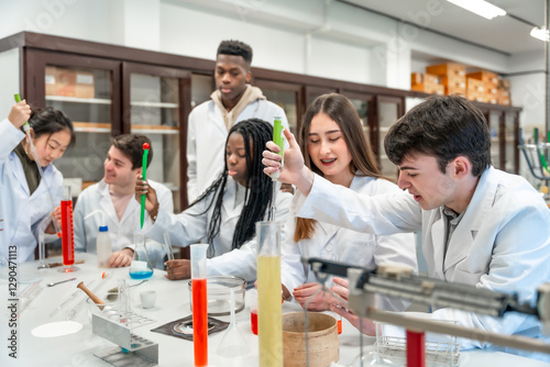 University students conducting chemistry experiment in lab