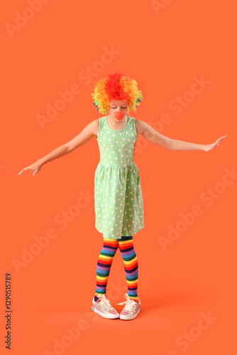 Funny girl in clown costume...