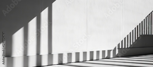 Modern architectural details with sharp black and white shadows cast on a smooth white wall; strong geometric lines create dynamic visual interest.