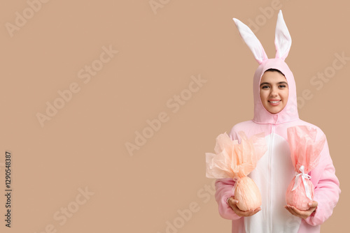Happy young woman in bunny ...