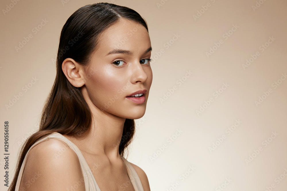 Young woman with natural makeup, showcasing healthy skin in a minimalist portrait with a neutral background and warm tones, emphasizing beauty and confidence Young woman with natural makeup, showcasing healthy skin in a minimalist portrait with a neutral background and warm tones, emphasizing beauty and confidence