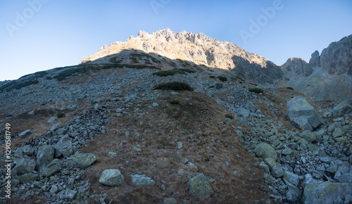 Obraz na płótnie Travel along a marked mountain trail in the High Tatras. Landscape of high mountains.
w salonie