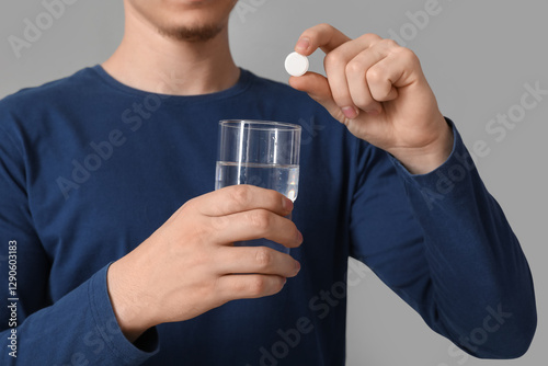 Man putting soluble tablet ...
