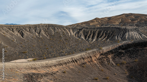 Tableau sur toile An intriguing view of a barren hillside showcasing distinct geological layers, illustrating the earth's natural history and the beauty of erosion in a stark environment