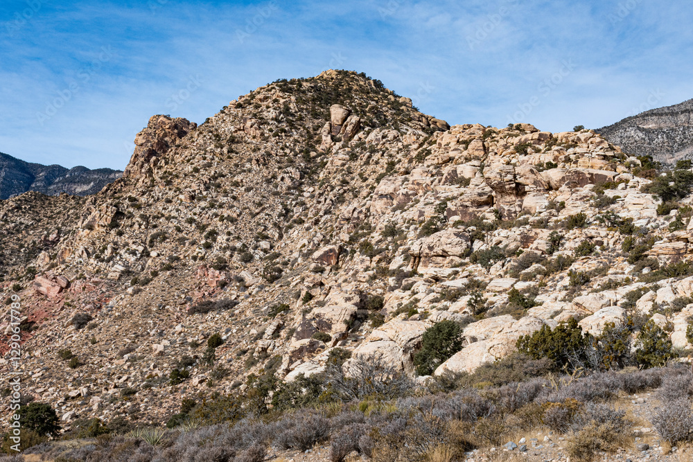 A captivating view of rocky mountain terrain under a bright blue sky, emphasizing natural beauty, ruggedness, and the appeal of outdoor exploration. A captivating view of rocky mountain terrain under a bright blue sky, emphasizing natural beauty, ruggedness, and the appeal of outdoor exploration.