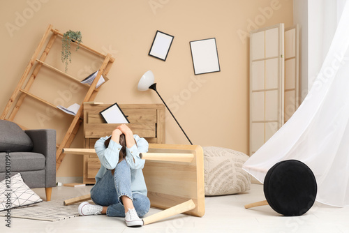 Distressed woman sitting on...