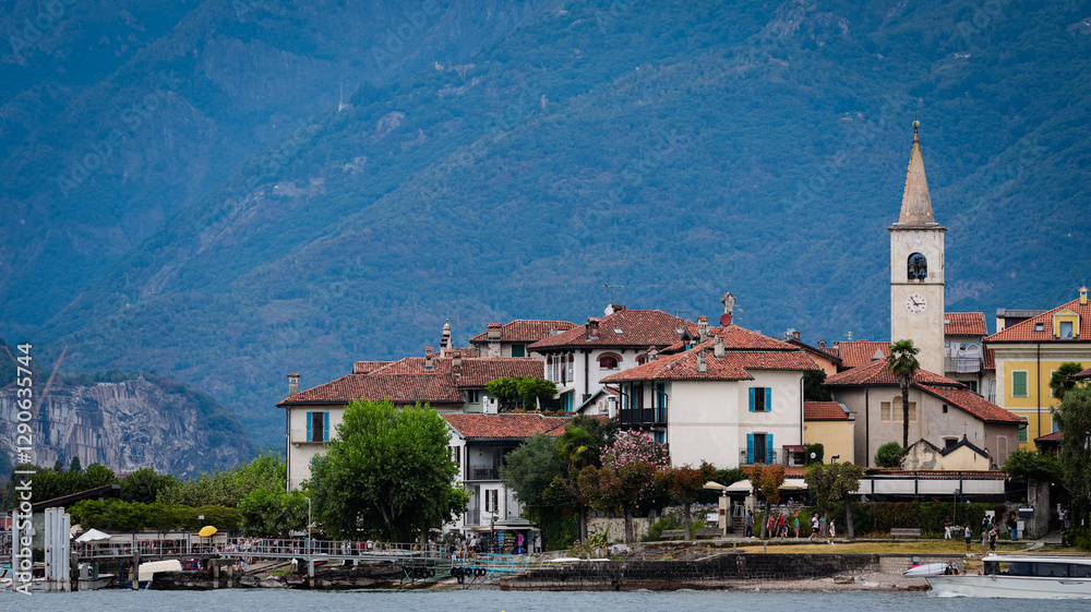 Fototapeta premium Charming Isola Superiore village with green mountains in northern Italy during daytime