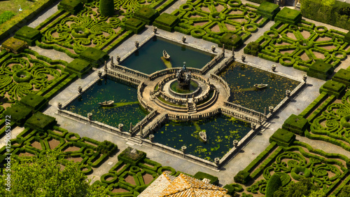 Aerial view of a beautiful fountain inside a decorated garden of a beautiful villa with park. It is located in Bagnaia, In the province of Viterbo, Italy.