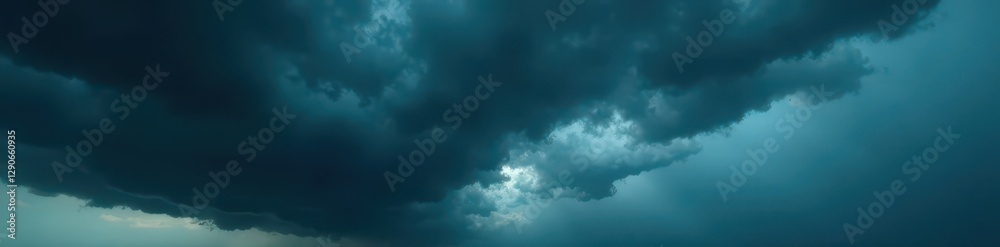Fototapeta premium Dense, black storm clouds gather, swirling violently, threatening downpour , atmospheric, nature