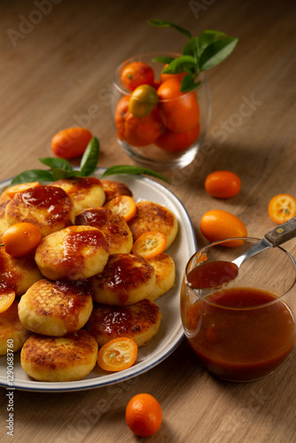 Obraz na płótnie Homemade pancakes with cottage cheese, kumquat jam and fruits on a table w salonie