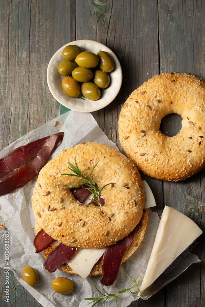 Burger with cheese, basturma and rosemary, top view